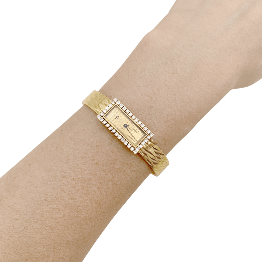 Montre vintage UTI, mouvement Blancpain, or jaune, diamants.