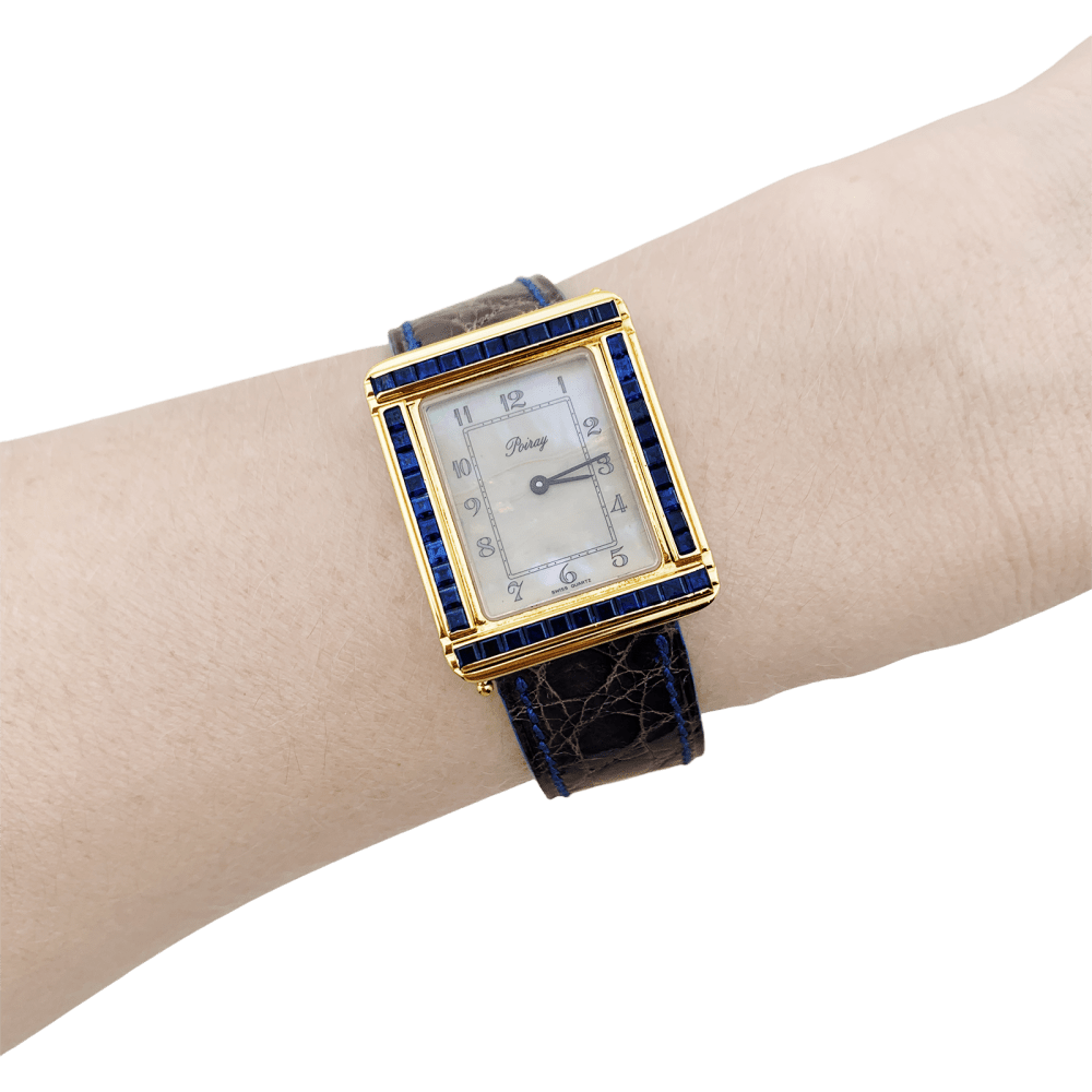 Montre Poiray, "Ma Première", or jaune, nacre, saphir, cuir. - Maison Eloe