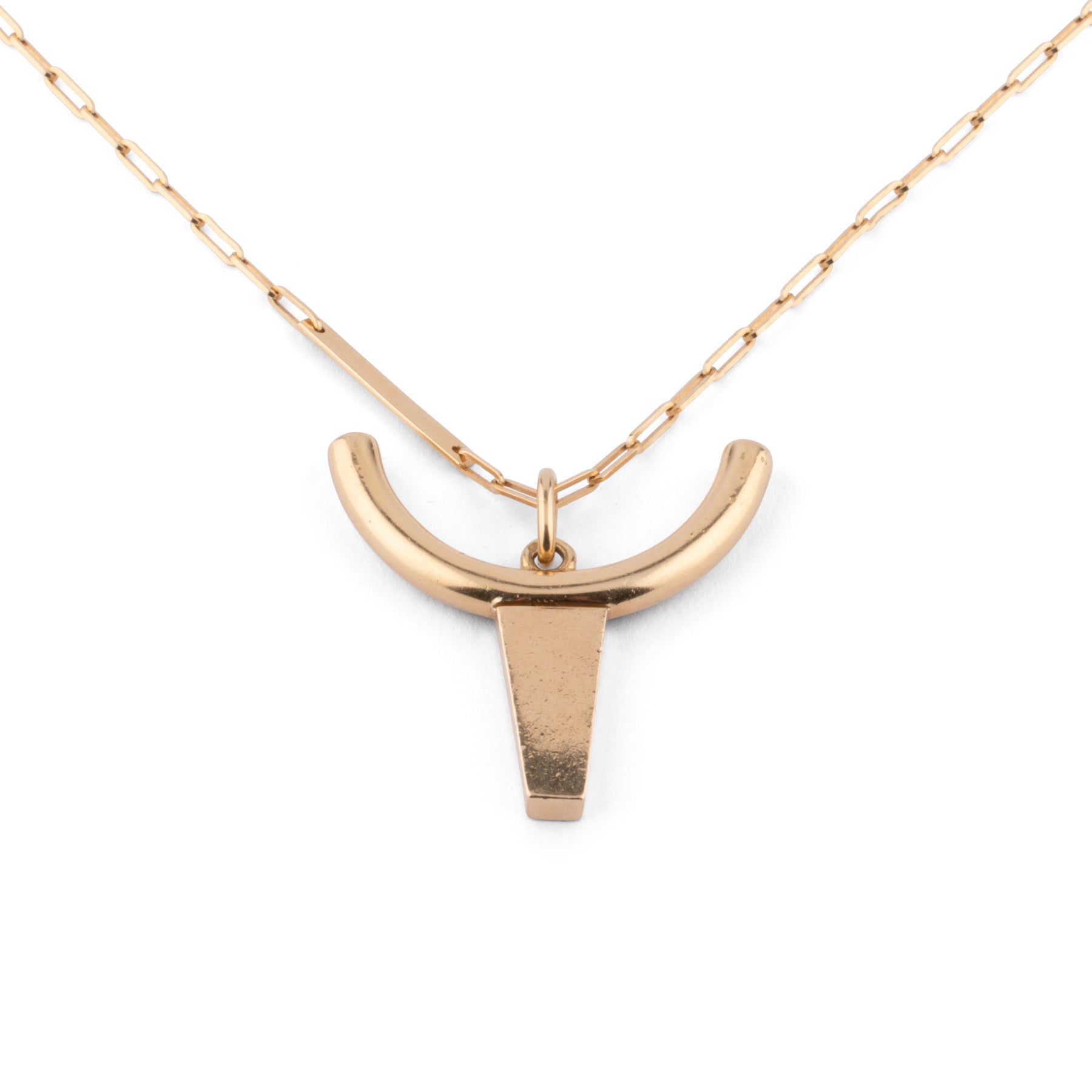 Yellow gold necklace decorated with a pendant representing a bull's head