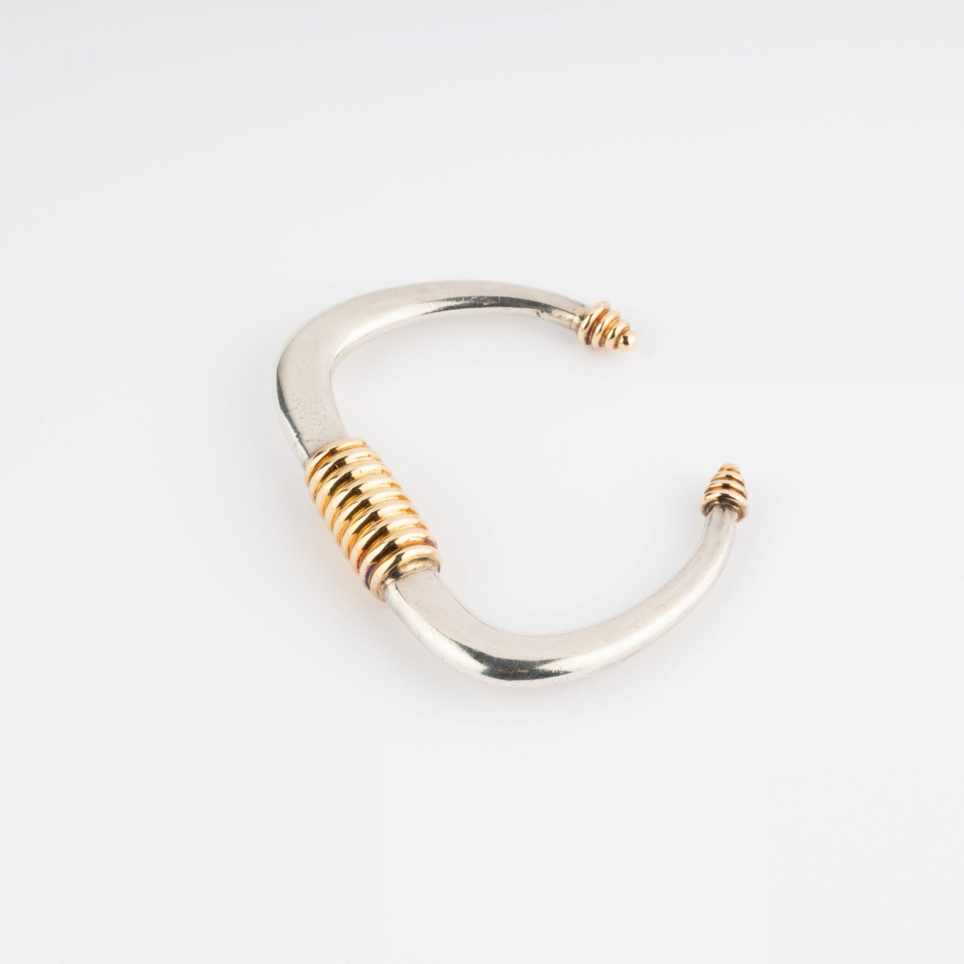 Silver and gold rigid bracelet from Zolotas
