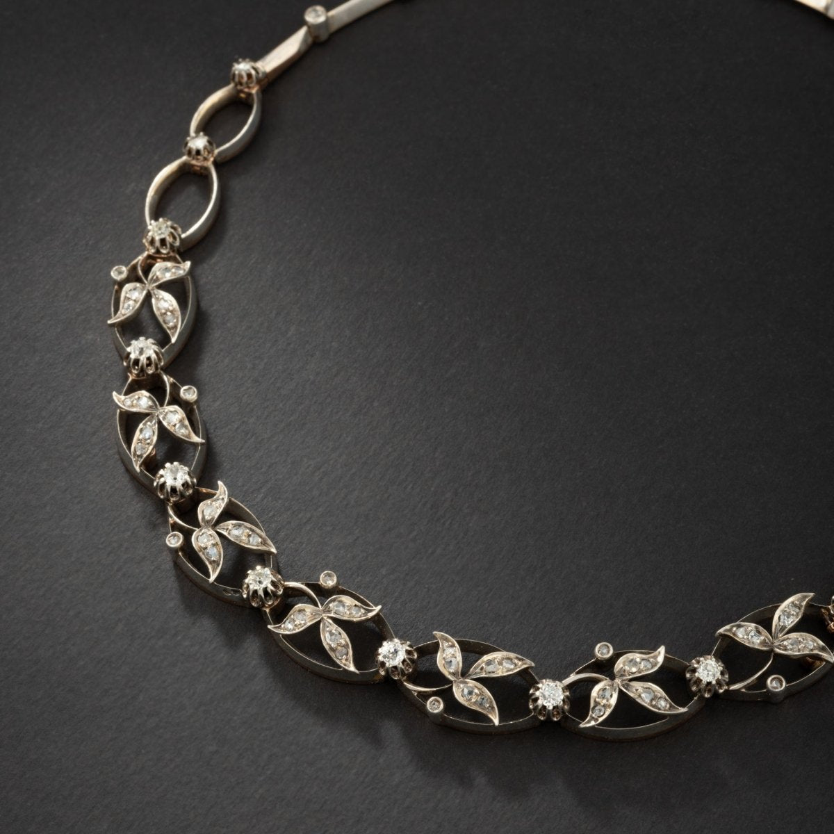 Collier transformable en deux bracelets en or et argent rehaussé de diamants. - Maison Eloe