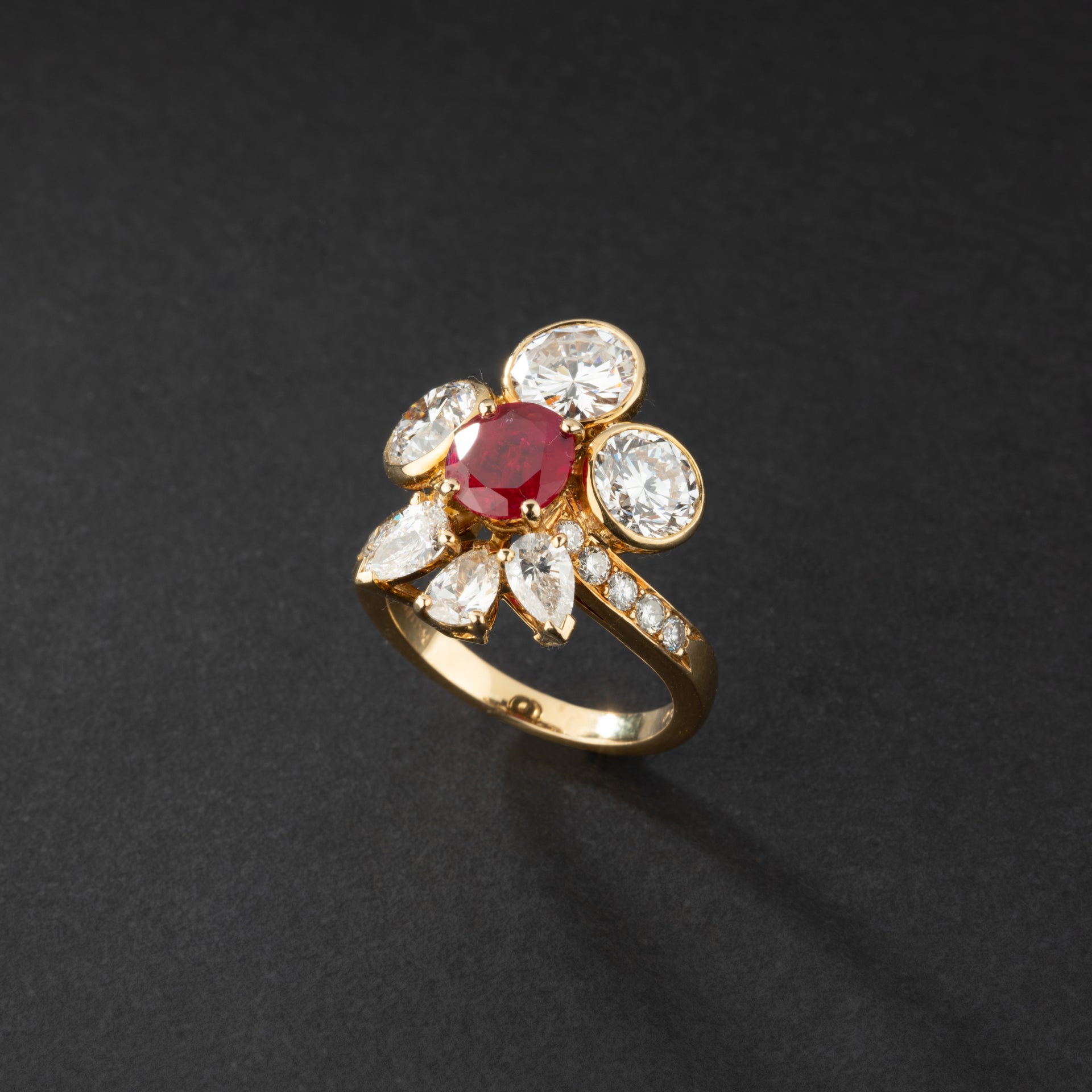 Yellow gold ring adorned with a natural Burmese Ruby and diamonds, signed MELLERIO