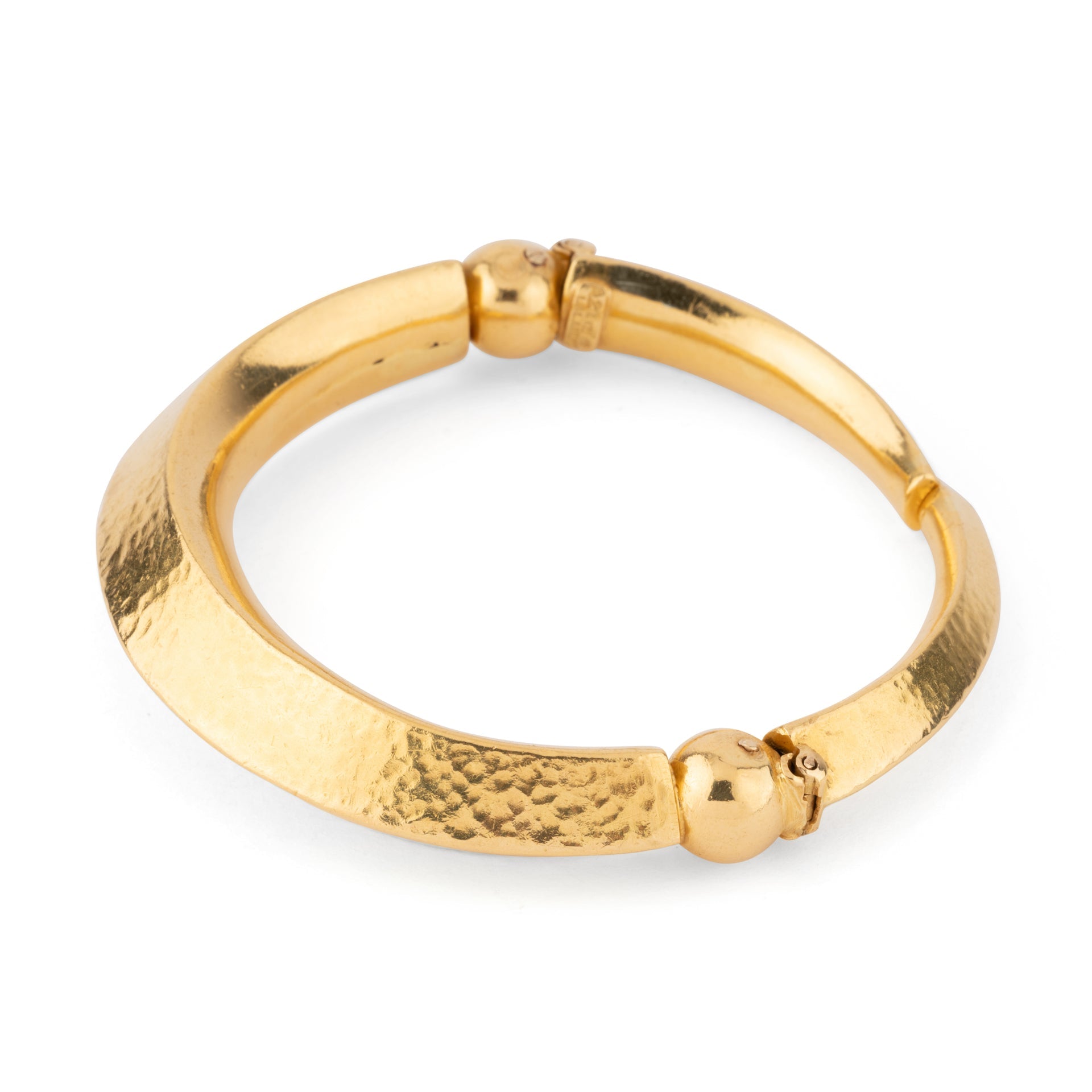 22k hammered yellow gold bangle bracelet by designer Lalaounis