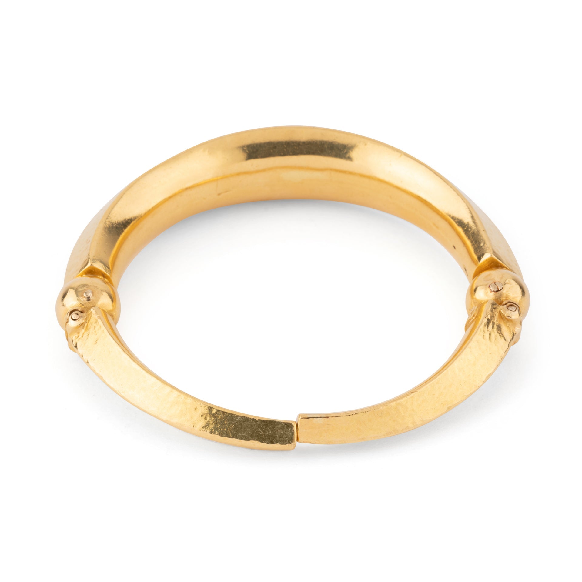 22k hammered yellow gold bangle bracelet by designer Lalaounis