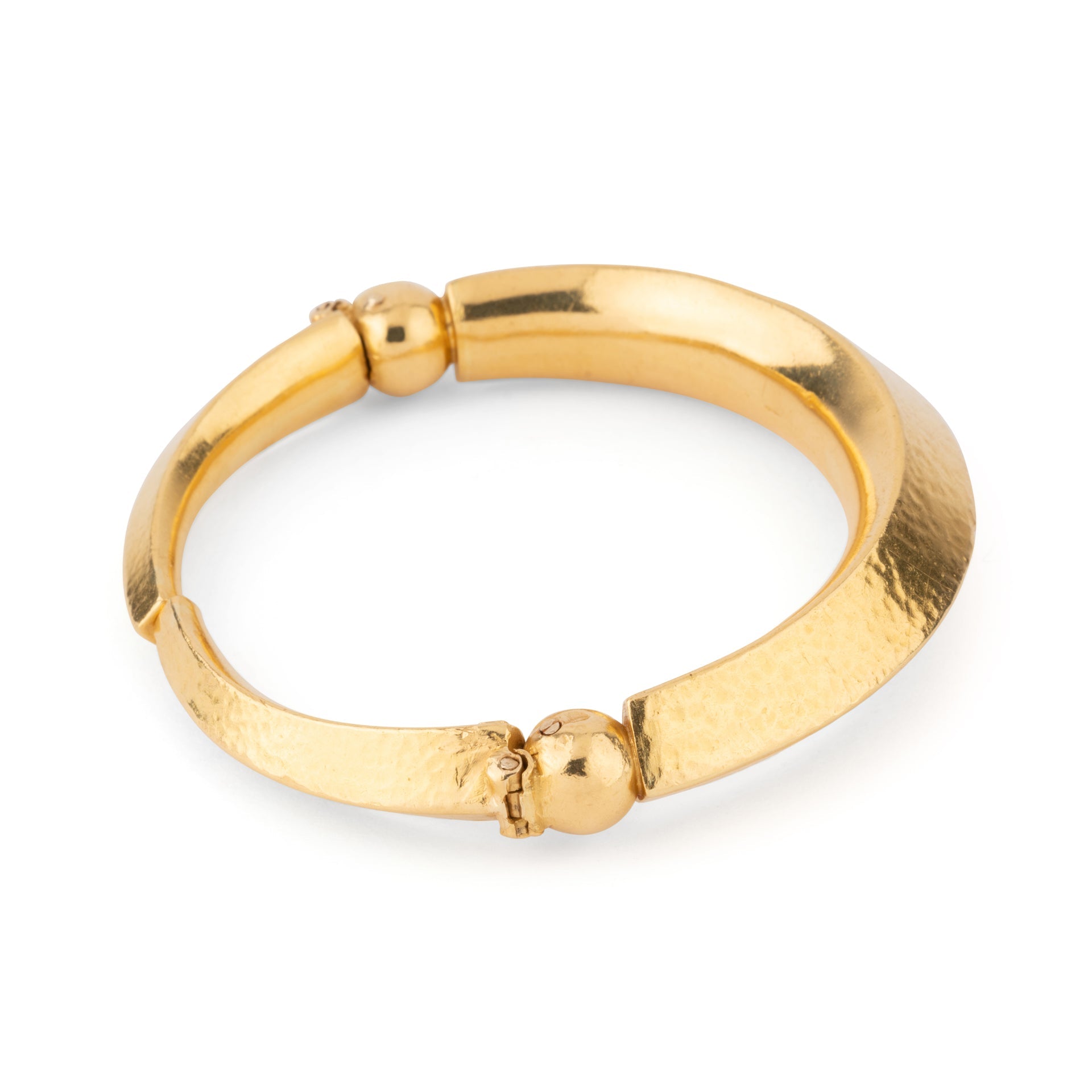 22k hammered yellow gold bangle bracelet by designer Lalaounis