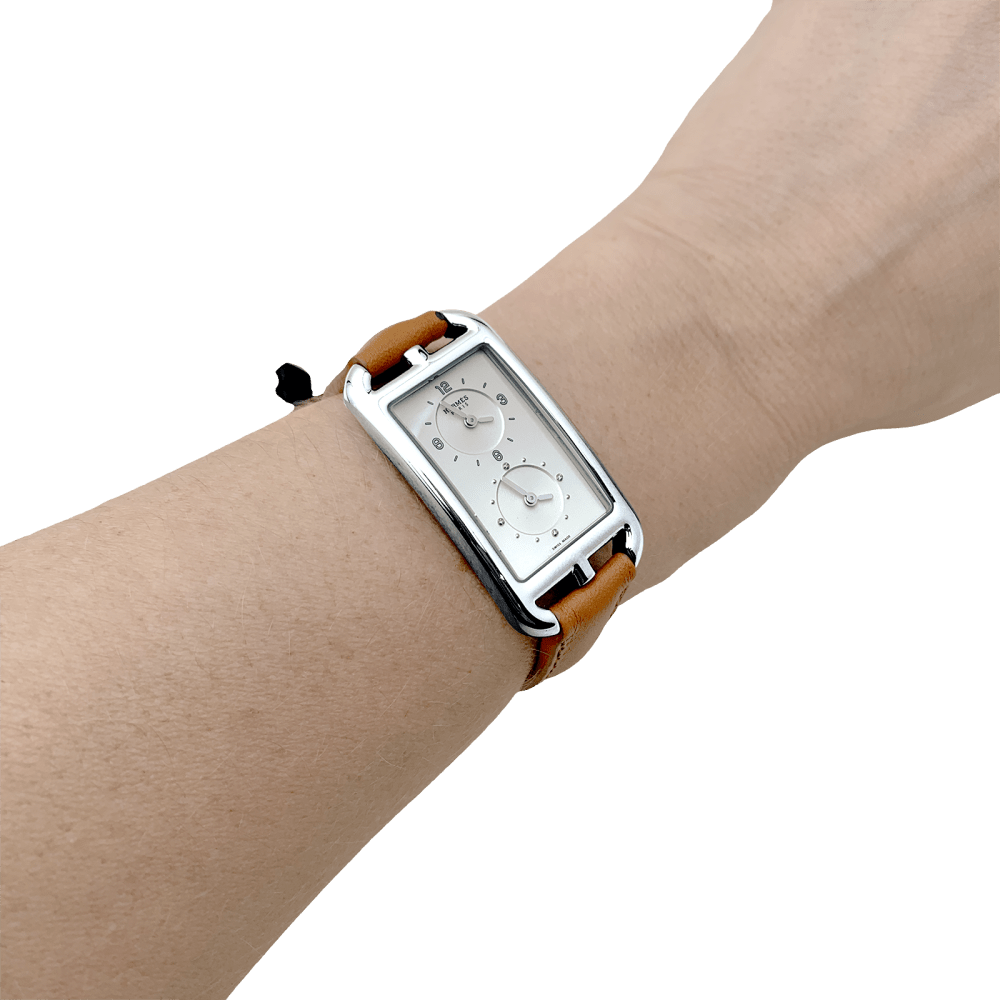 Montre Hermès, "Nantucket Dual Time", acier, cuir, diamants.