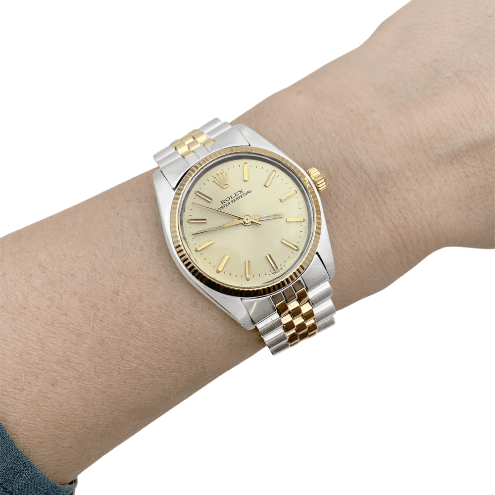 Montre Rolex, "Oyster Perpetual", or jaune et acier.