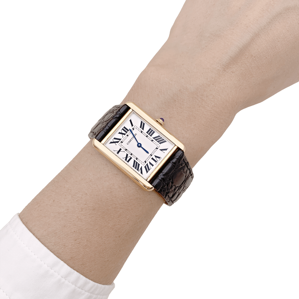 Montre Cartier, "Tank Solo", or jaune et acier.