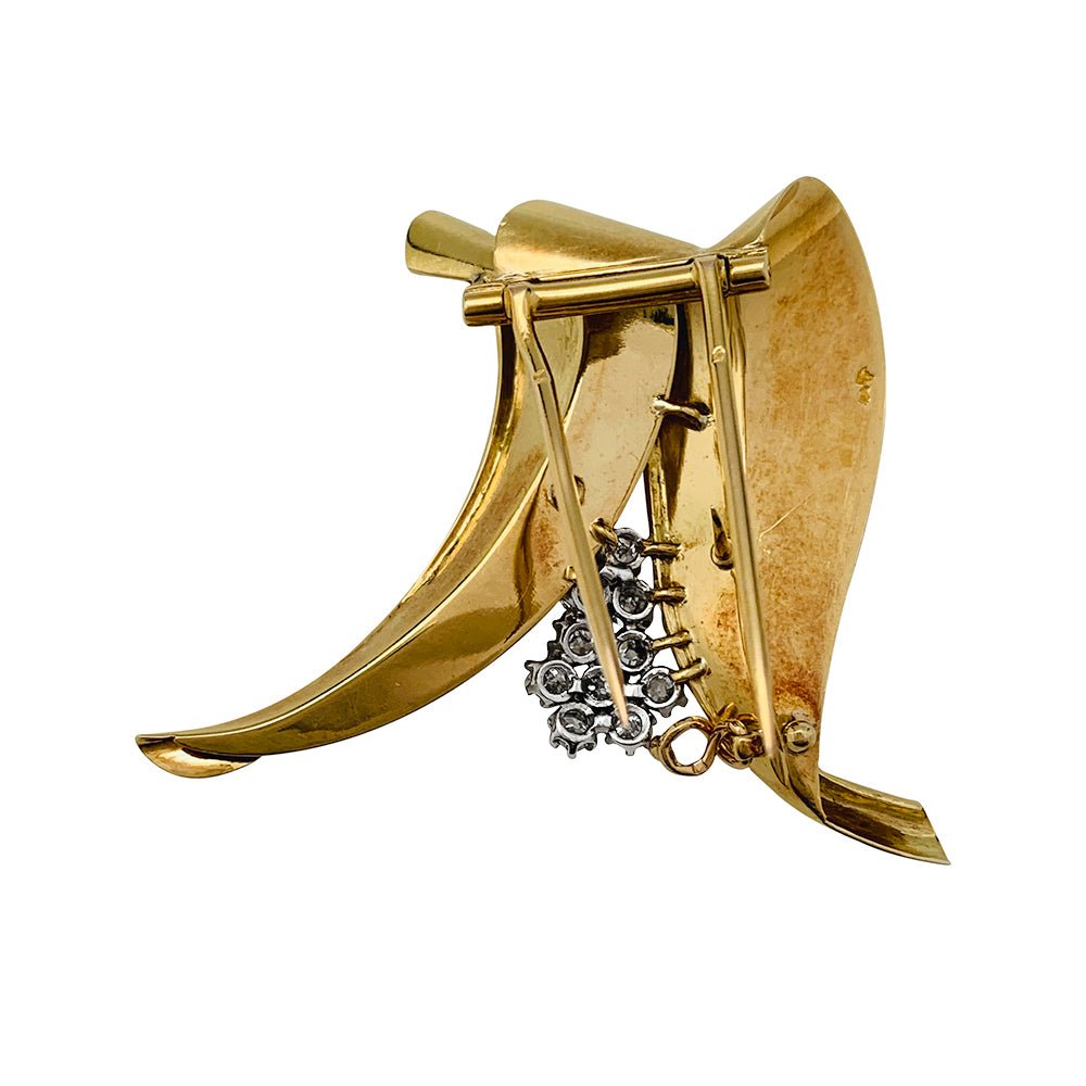 Broche Fontana en or jaune 750/000 et platine 950/000 sertie de 10 diamants taille ancienne. Poids brut : 11,4 grammes. - Maison Eloe