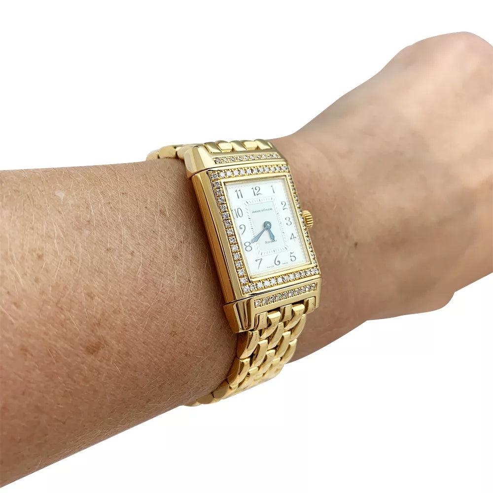 Montre Jaeger Lecoultre "Reverso Duetto" en or jaune, nacre et diamants.