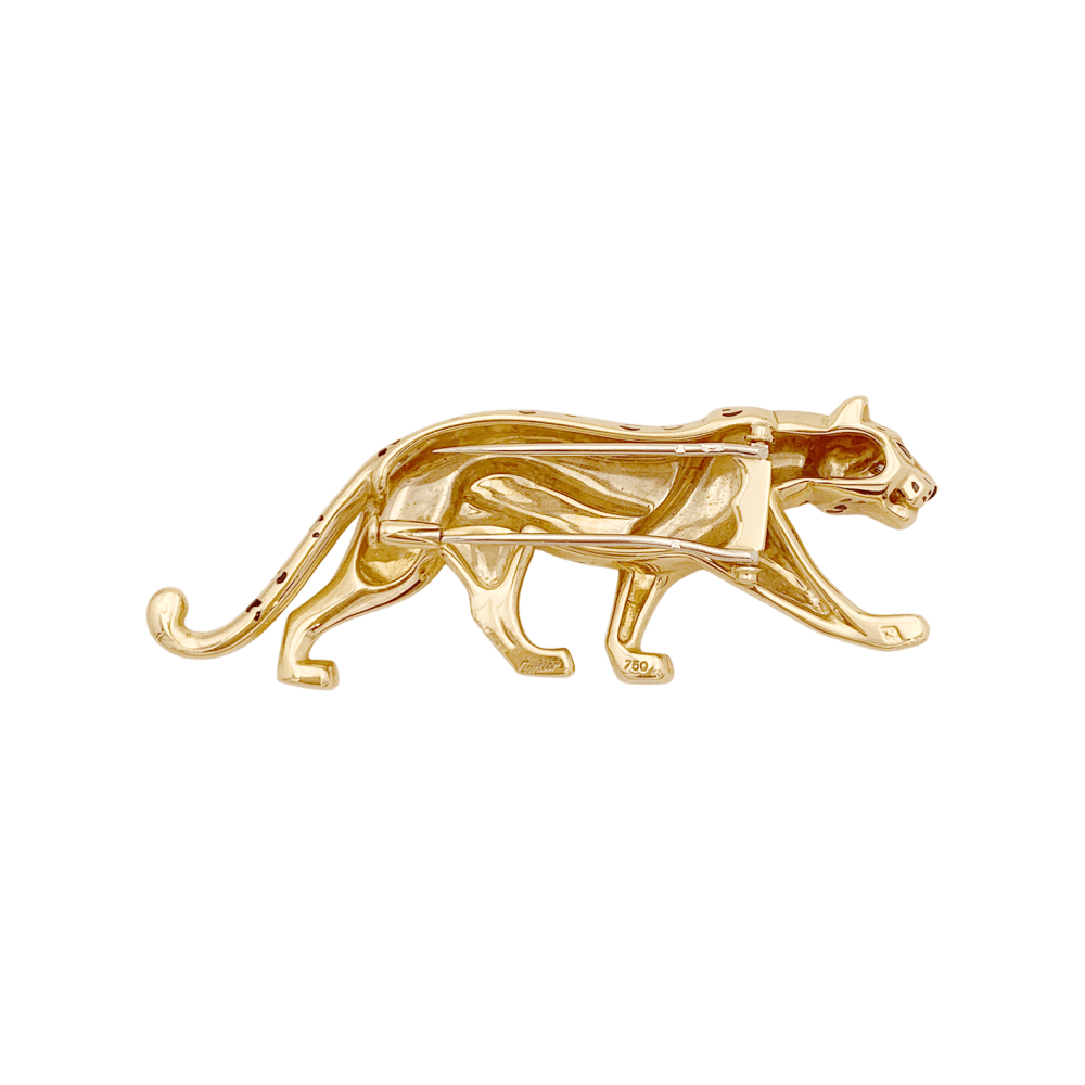 Broche Cartier, "Panthère", or jaune, émail, émeraudes.