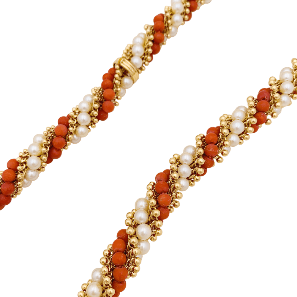 Collier-Sautoir Van Cleef & Arpels, "Twist", or jaune, corail, perles.