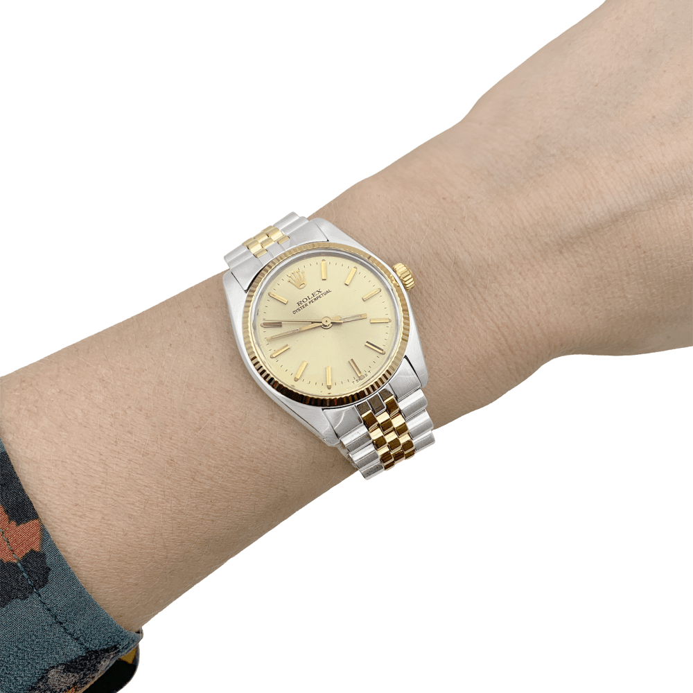 Montre Rolex, "Oyster Perpetual", or jaune et acier.
