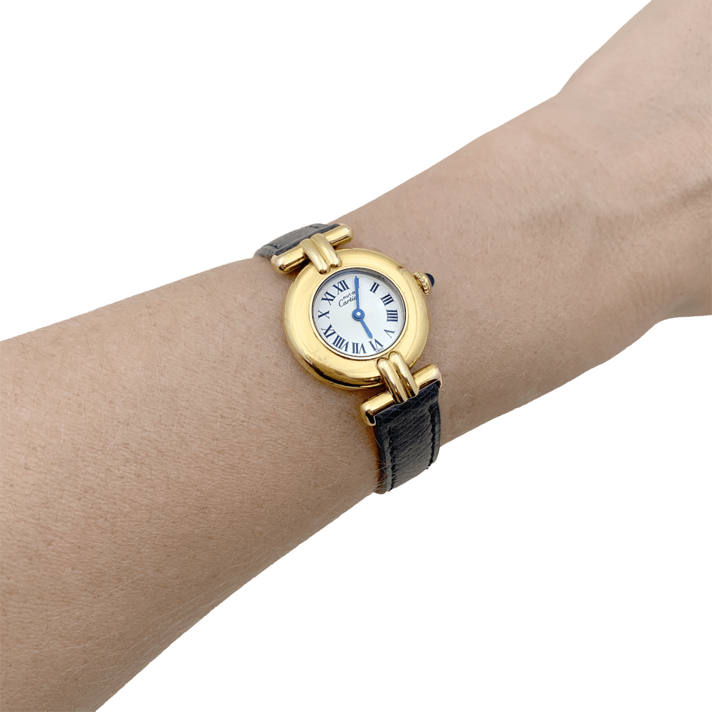 Montre Cartier, "Colisée Must", argent plaqué or, cuir.