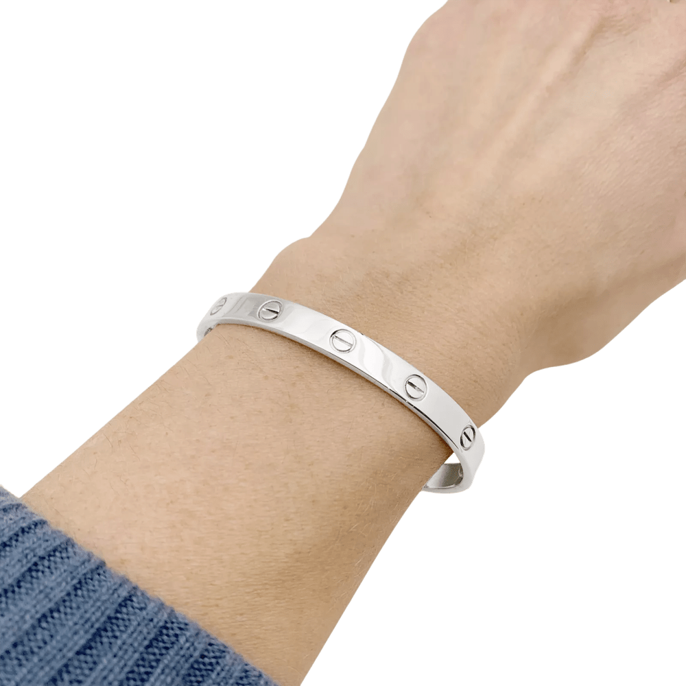 Bracelet Cartier, "Love", or blanc.