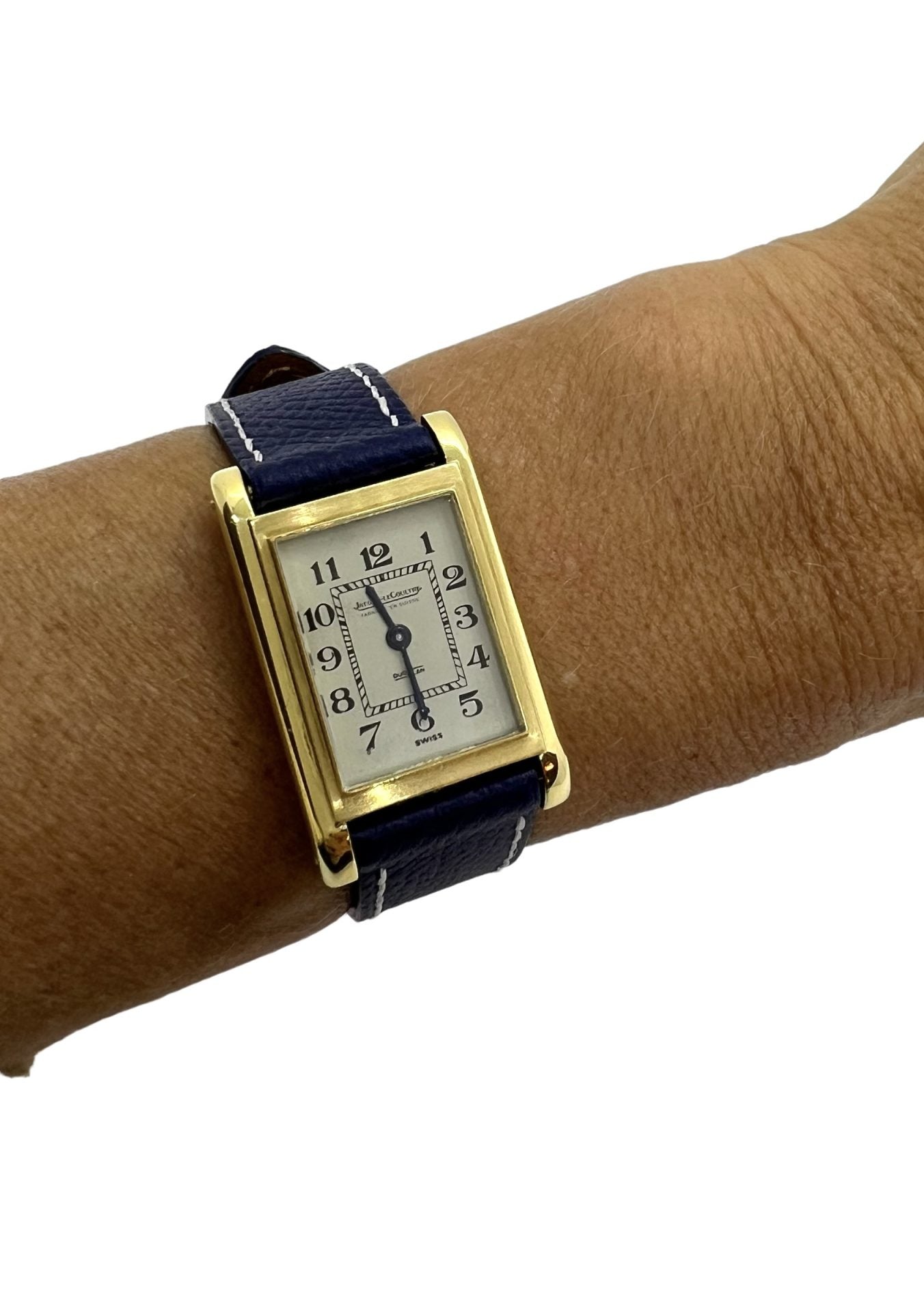 Jaeger Lecoultre, Montre Duoplan en or sur cuir.