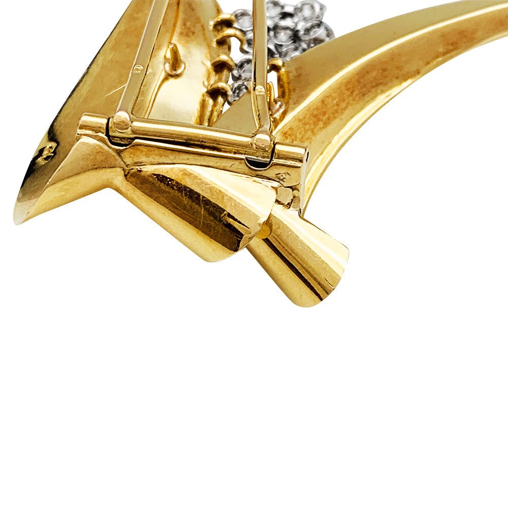 Broche Fontana en or jaune 750/000 et platine 950/000 sertie de 10 diamants taille ancienne. Poids brut : 11,4 grammes. - Maison Eloe