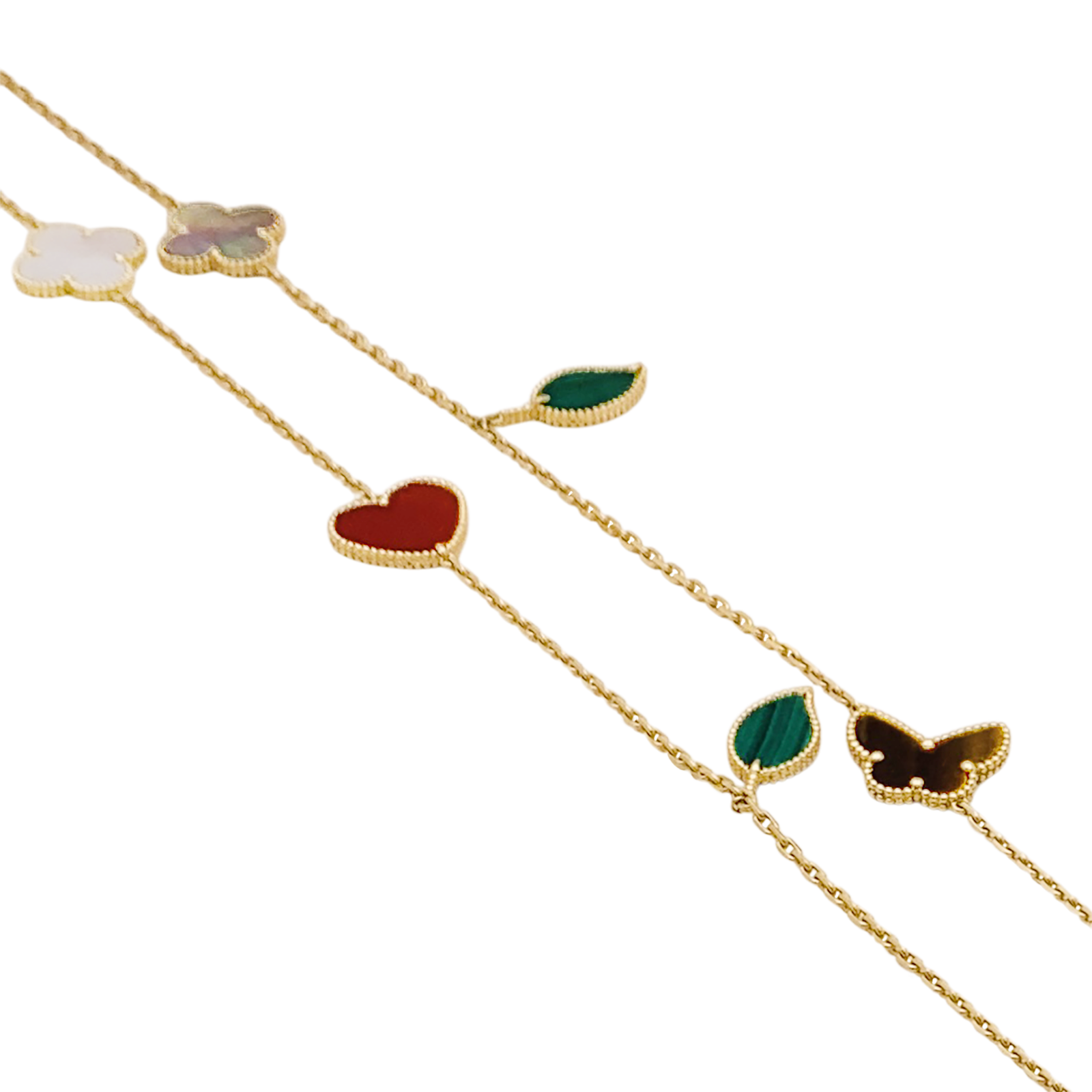 Collier-Sautoir Van Cleef & Arpels, "Lucky Alhambra", or jaune, cornaline, malachite, oeil de tigre, nacre.