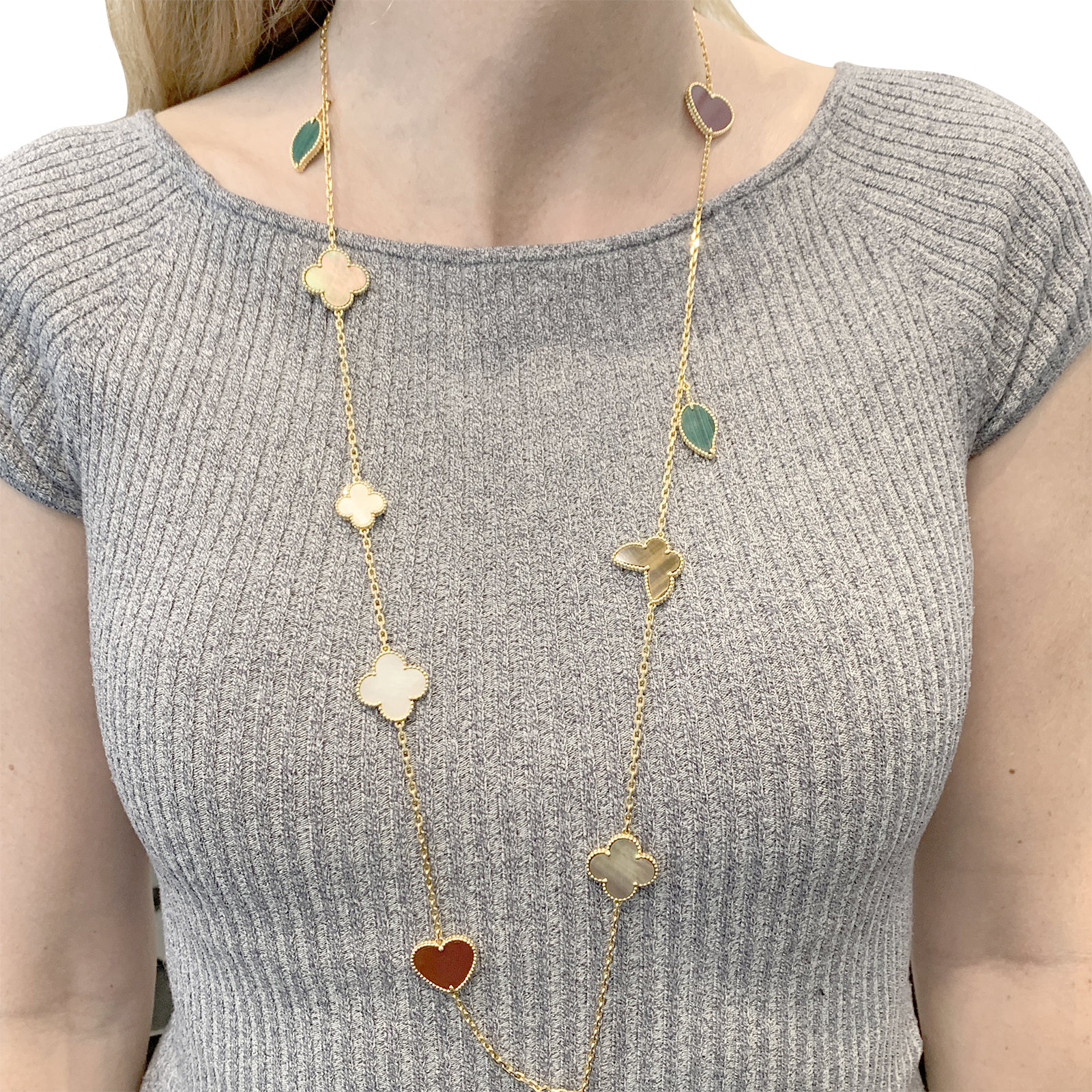 Collier-Sautoir Van Cleef & Arpels, "Lucky Alhambra", or jaune, cornaline, malachite, oeil de tigre, nacre.