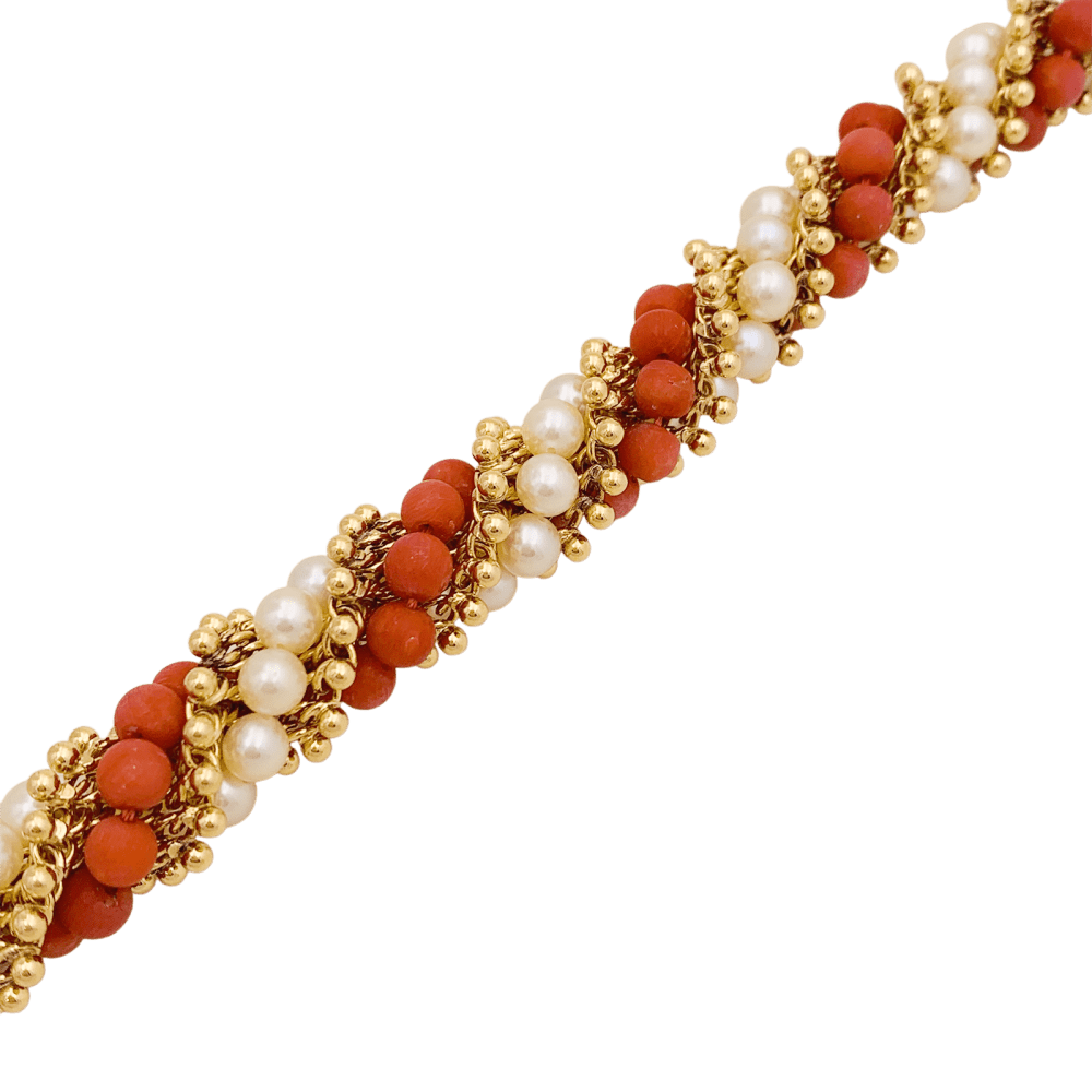 Bracelet Van Cleef & Arpels, "Twist", or jaune, corail, perles.
