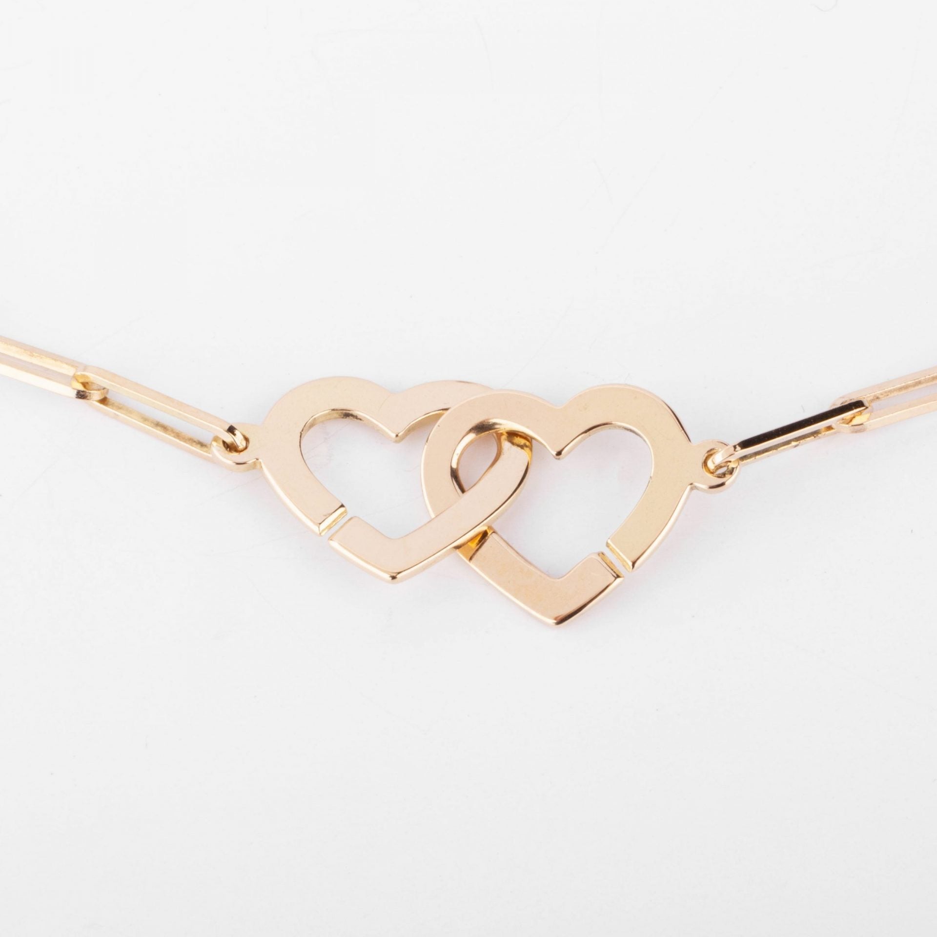 Dinh Van rose gold necklace forming 2 hearts