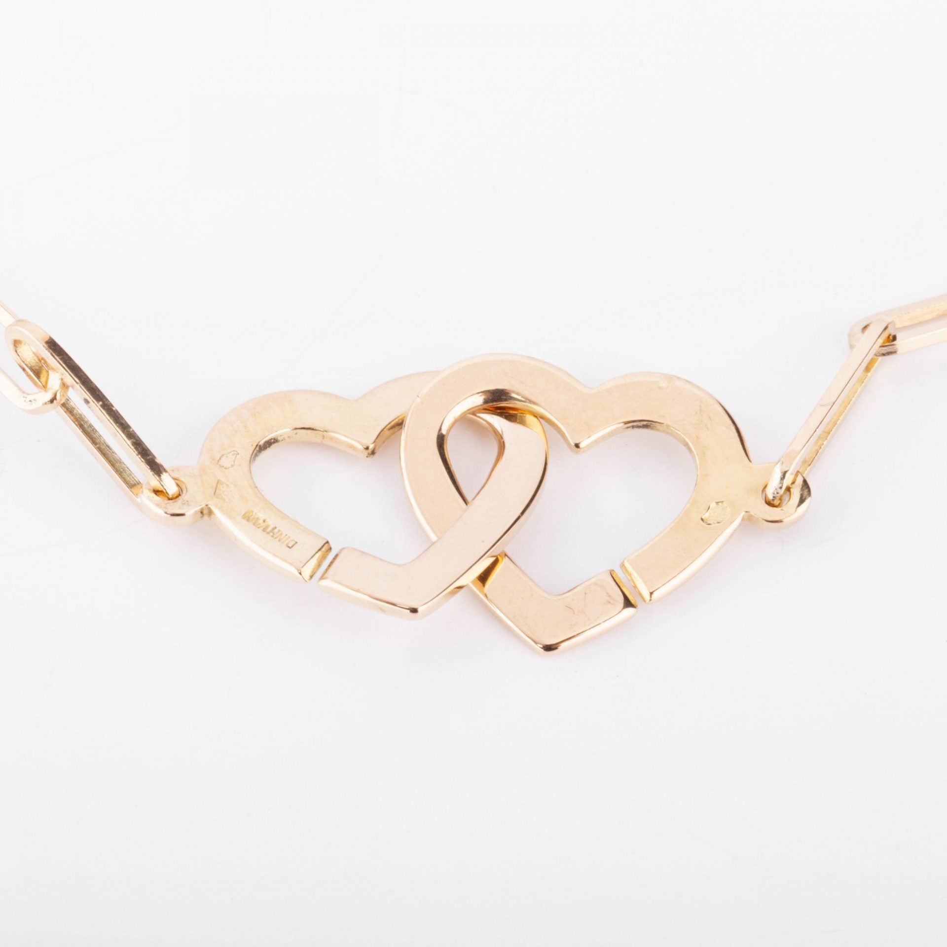 Dinh Van rose gold necklace forming 2 hearts