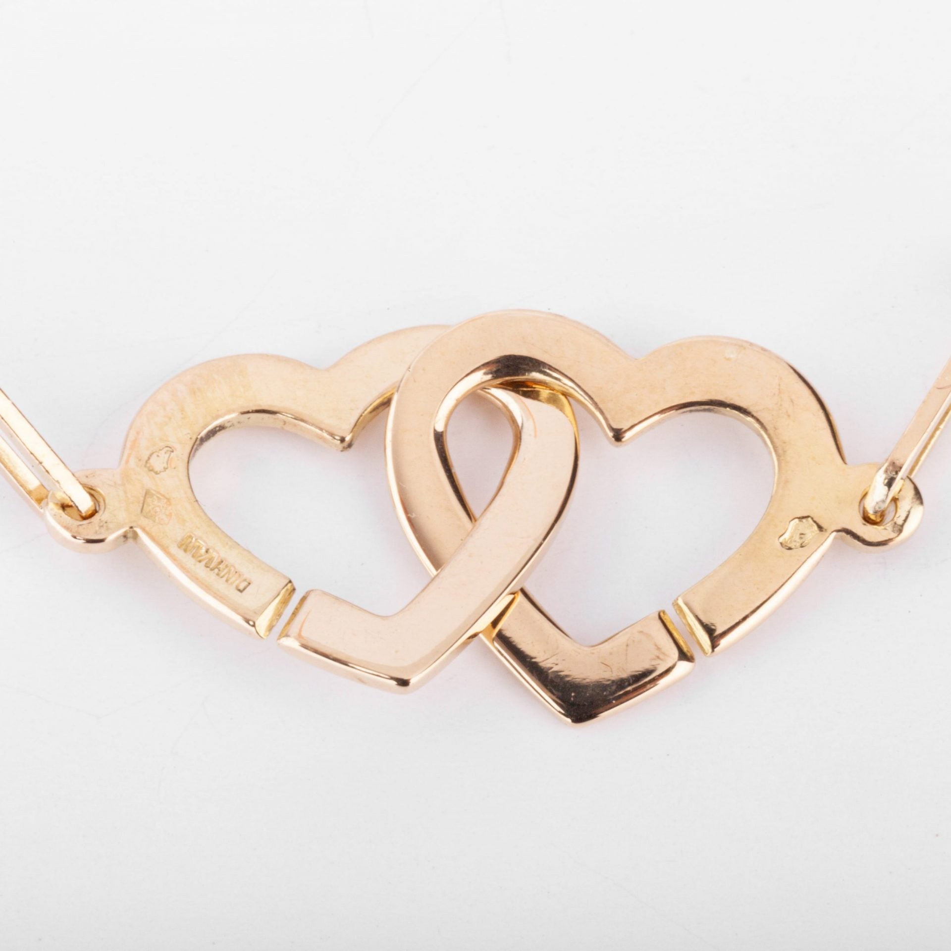Dinh Van rose gold necklace forming 2 hearts