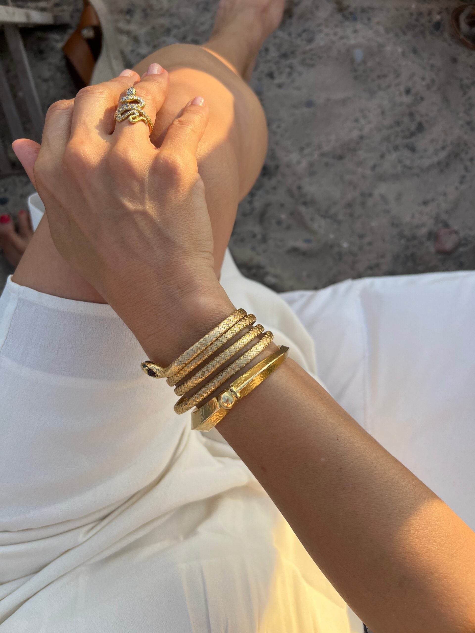 22k hammered yellow gold bangle bracelet by designer Lalaounis