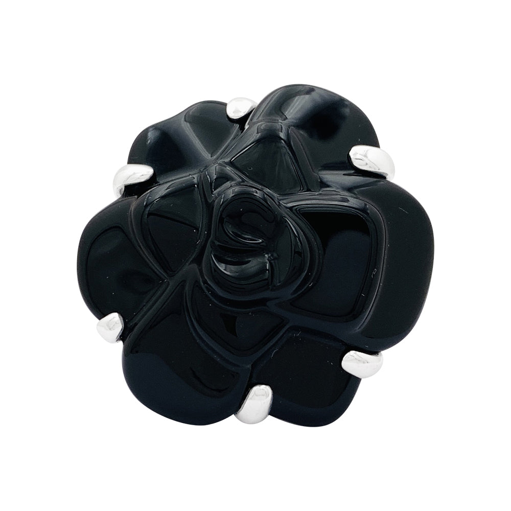 Chanel ring, "Camélia" model, in white gold and onyx.