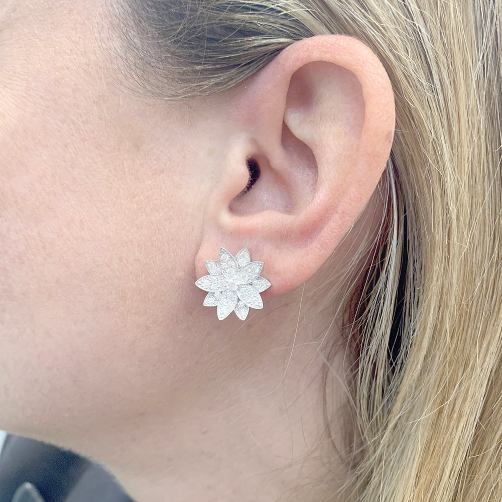 Van Cleef &amp; Arpels "Lotus" earrings in white gold and diamonds.