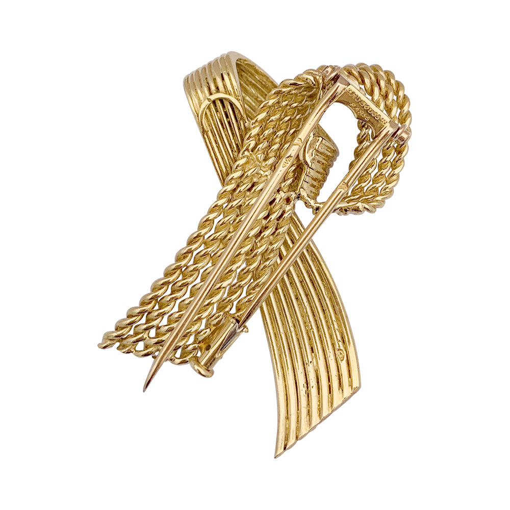 Vintage Mauboussin "Ribbon" brooch, yellow gold.