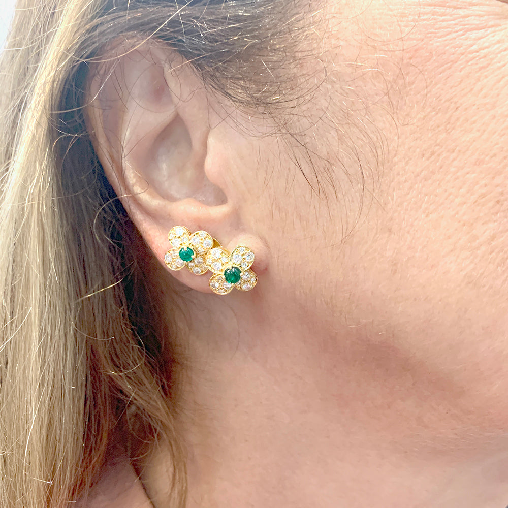 Van Cleef &amp; Arpels "Fleurette" clips in yellow gold, diamonds and emeralds.