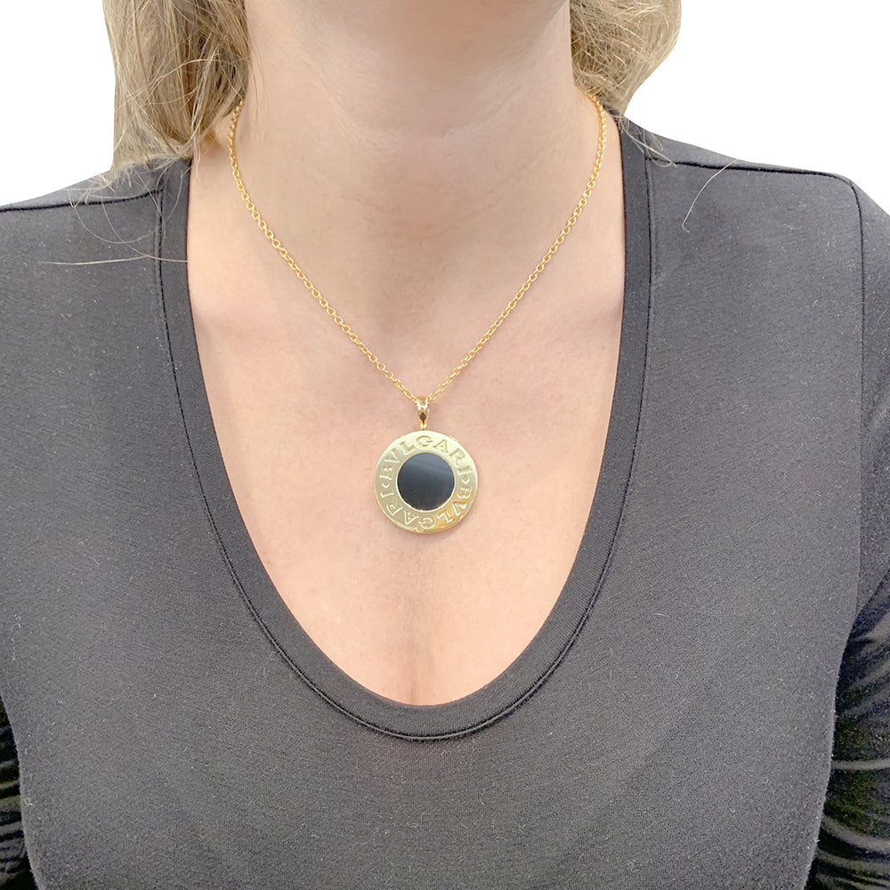 Bulgari "Bulgari Bulgari" necklace in yellow gold, steel, and onyx.