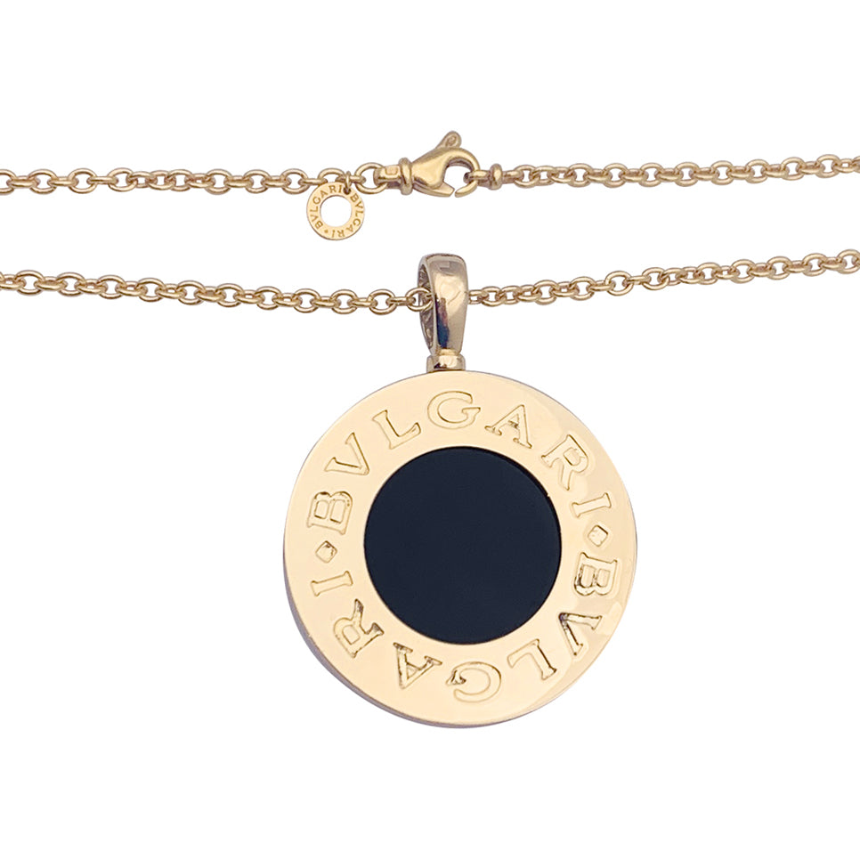 Bulgari "Bulgari Bulgari" necklace in yellow gold, steel, and onyx.