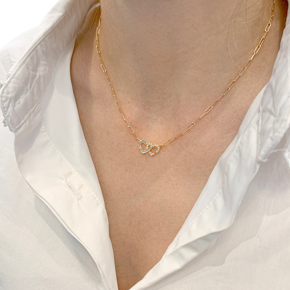 Dinh Van "Double Heart" necklace in rose gold and diamonds.