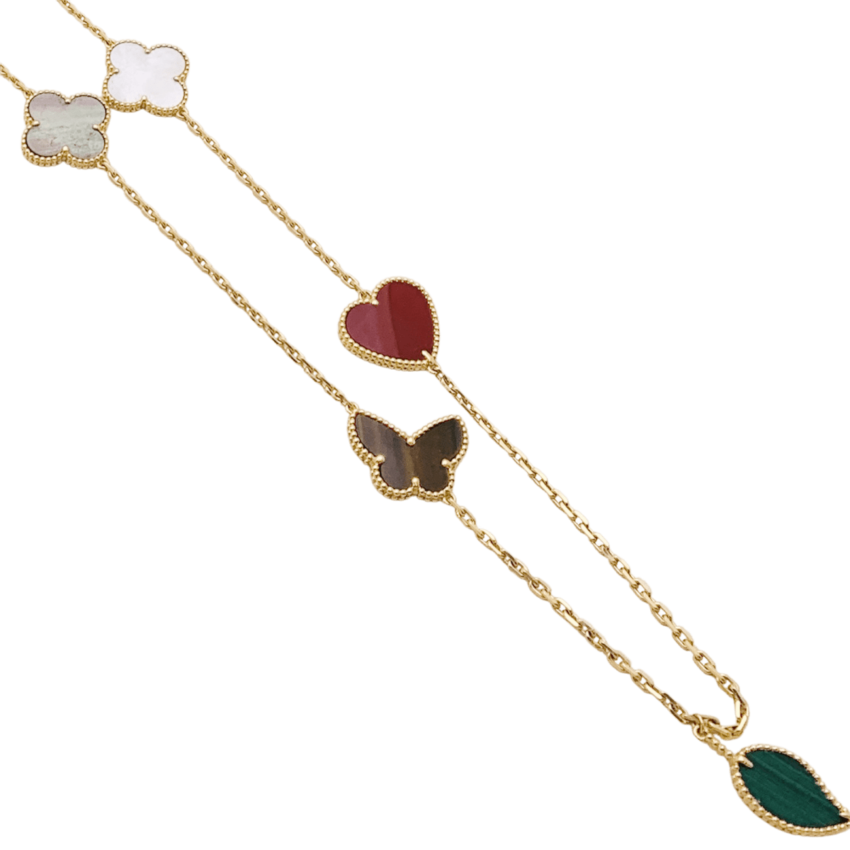 Collier - Sautoir Van Cleef & Arpels, "Lucky Alhambra", or jaune, cornaline, malachite, oeil de tigre, nacre. - Maison Eloe