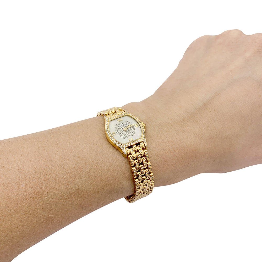 Cartier "Turtle" watch in yellow gold, diamonds, mother-of-pearl.