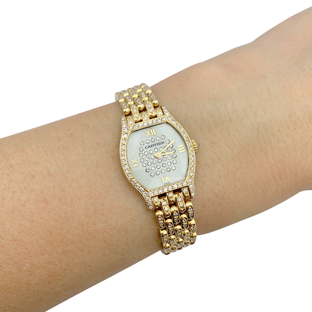 Cartier "Turtle" watch in yellow gold, diamonds, mother-of-pearl.