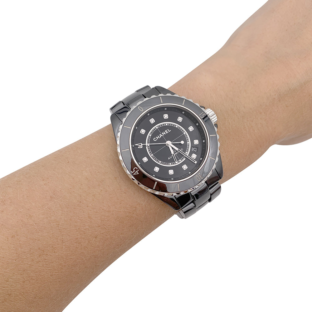Chanel J12 black ceramic watch with diamonds.