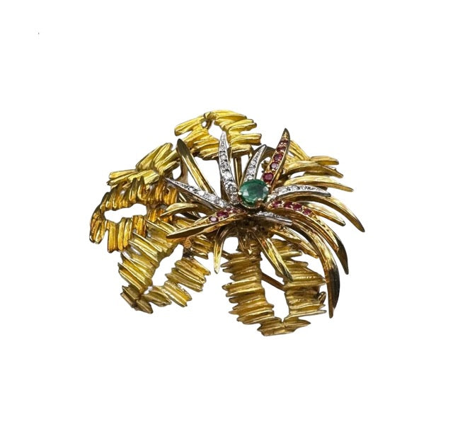 Mellerio 18k yellow gold brooch with emerald, rubies and diamonds