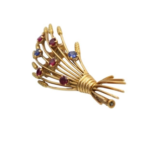 Mellerio, broche vintage en or jaune 18K rubis et saphirs - Maison Eloe