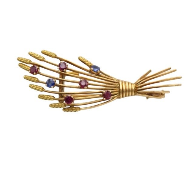 Mellerio, broche vintage en or jaune 18K rubis et saphirs - Maison Eloe