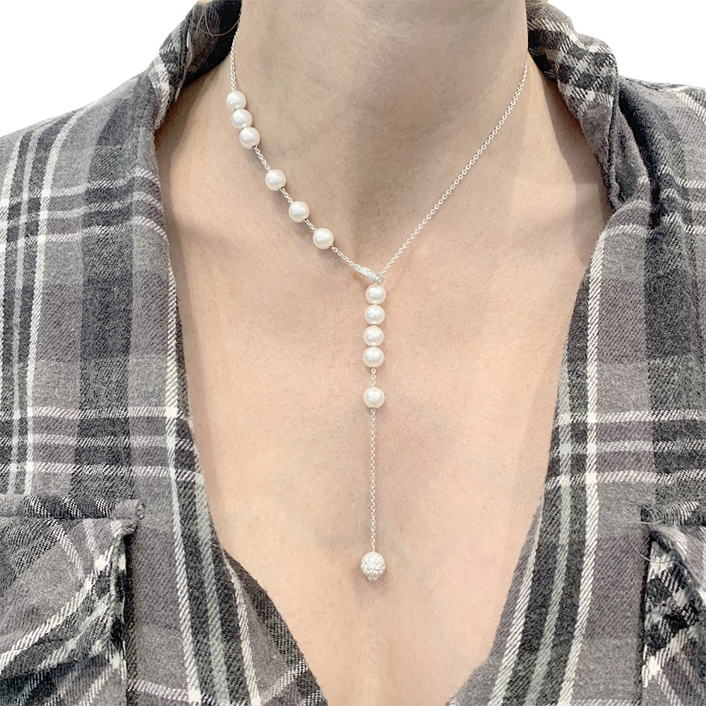 Mikimoto necklace in white gold, white pearls, diamonds.