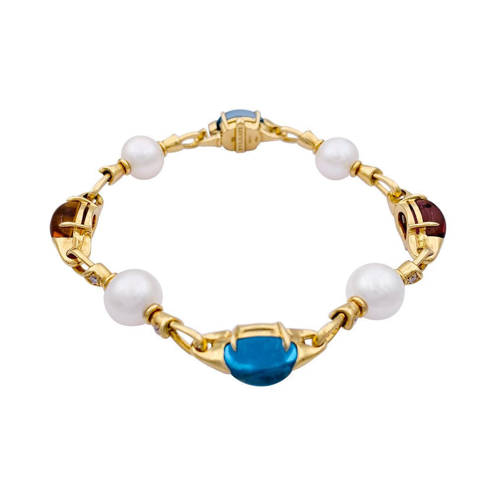 Bulgari bracelet in yellow gold, pearls, colored stones.