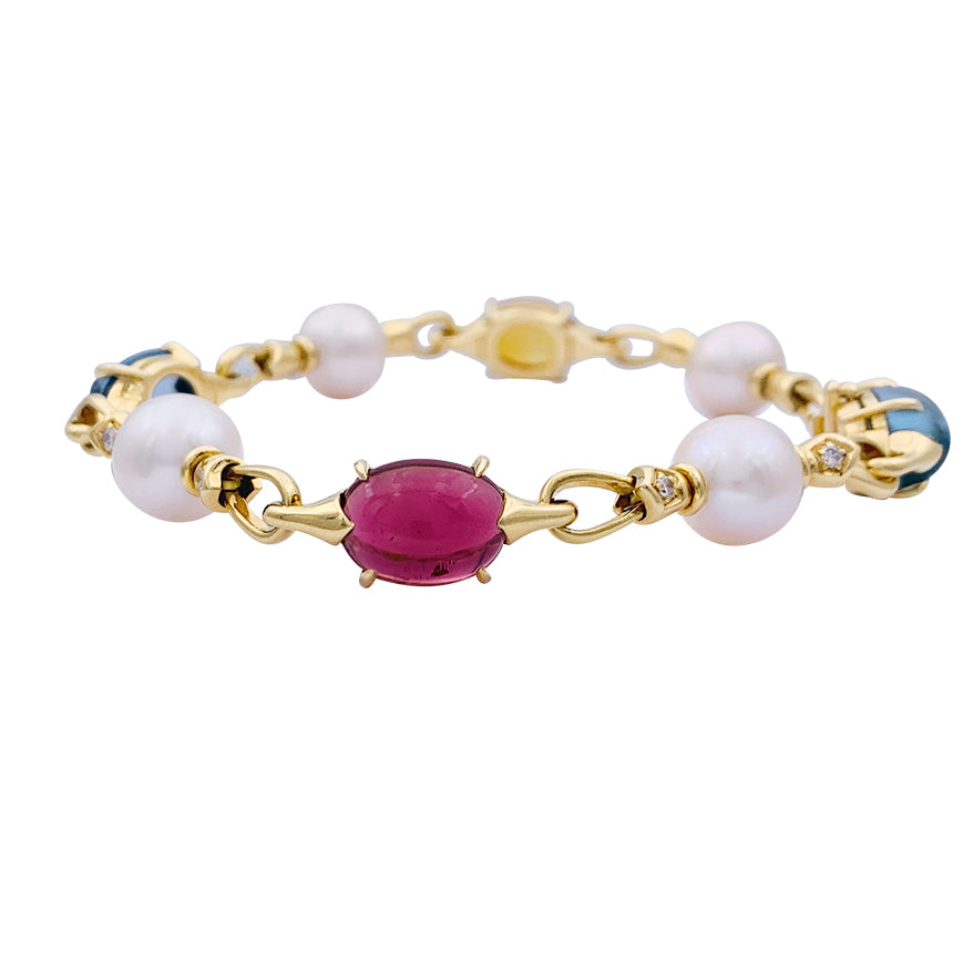 Bulgari bracelet in yellow gold, pearls, colored stones.