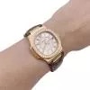 Montre Patek Philippe, "Nautilus", or rose, diamants, cuir.