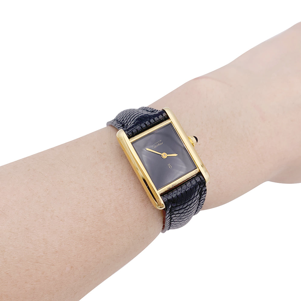 Cartier "Tank Must" watch, gold-plated silver, black lacquered dial.