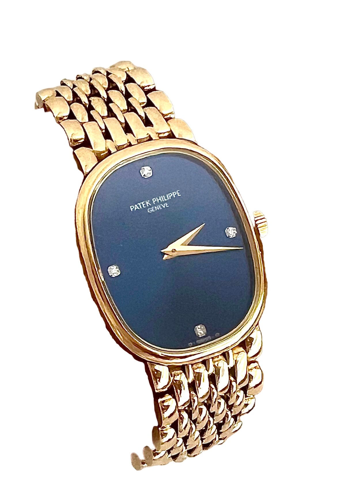 Une montre Patek Philippe vintage en or jaune 18k fond bleu