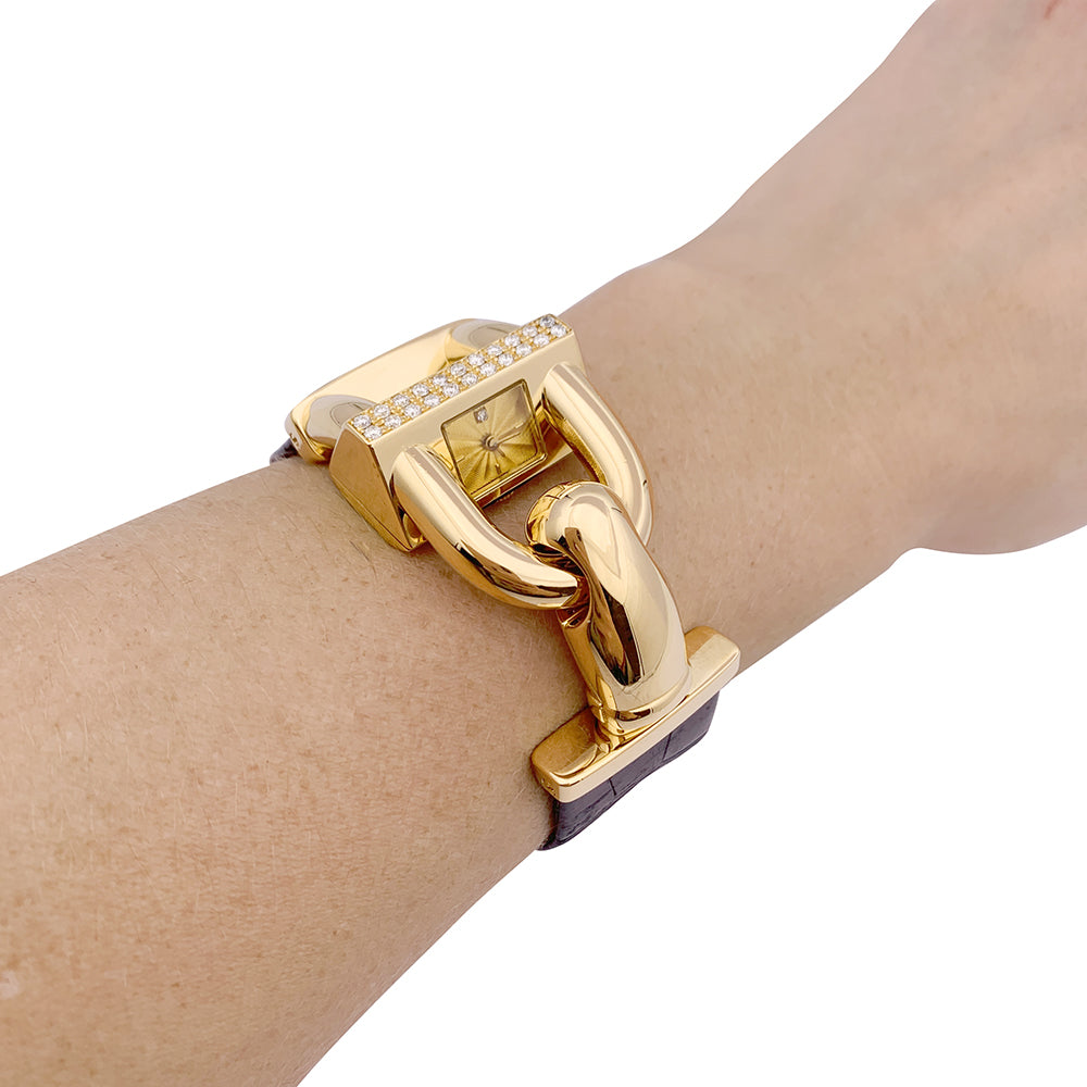 Van Cleef &amp; Arpels “Cadenas” watch in yellow gold, diamonds, leather.