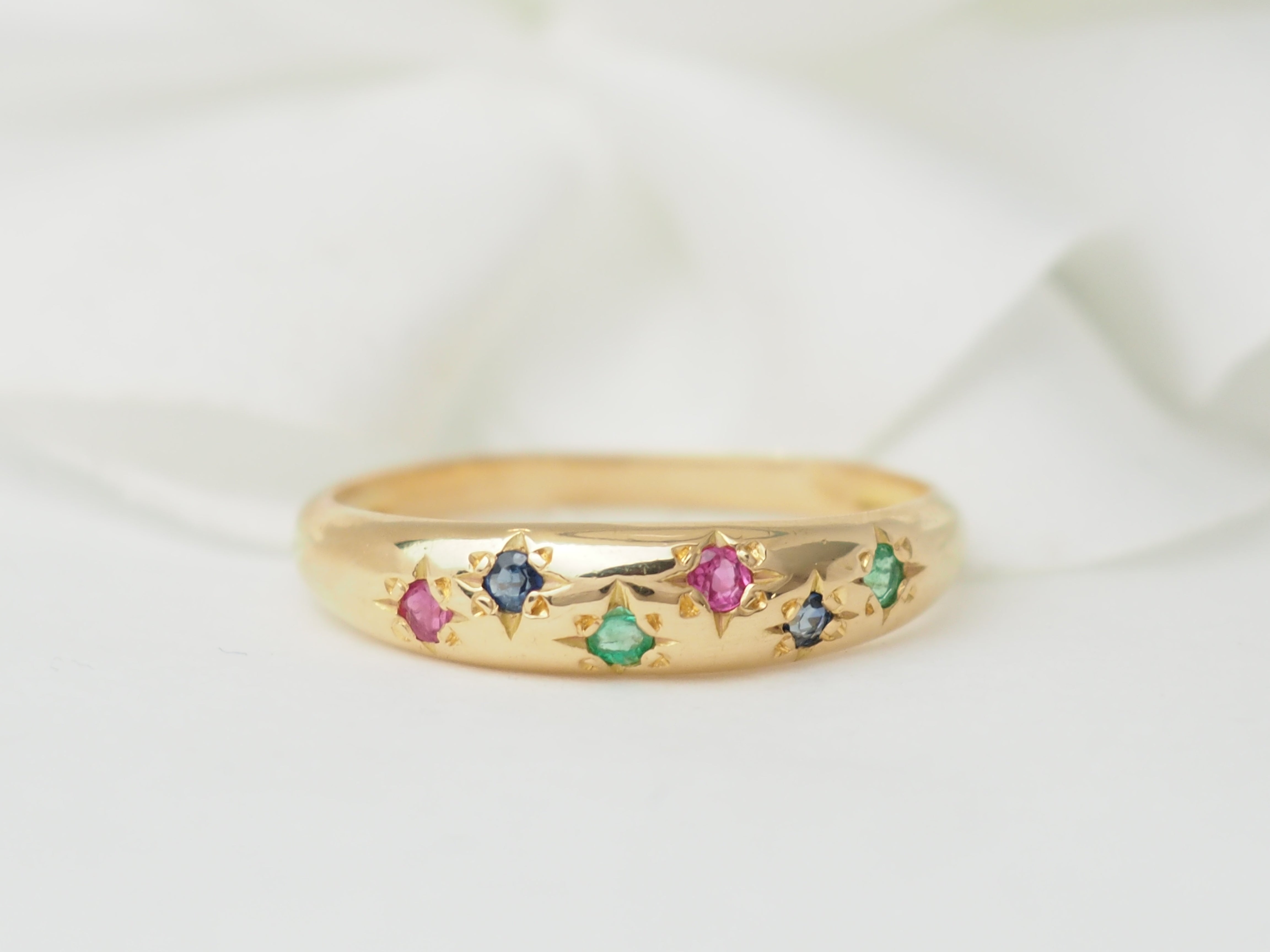 Bague jonc en or rose et pierres précieuses